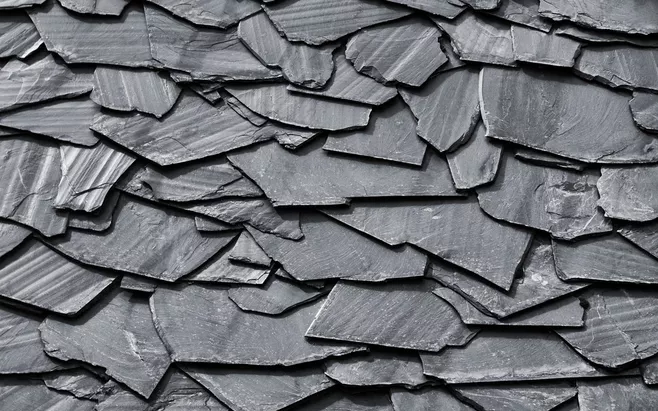 片岩它是一种典型的片状结构变质岩是岩石区域变质的产物片岩由片状和